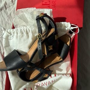 Valentino Garavani Black Leather Sandals with Gold Accents